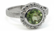 Ring Orbis mit Peridot