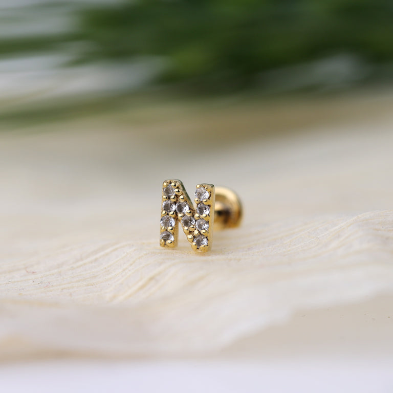 Piercing BUCHSTABEN