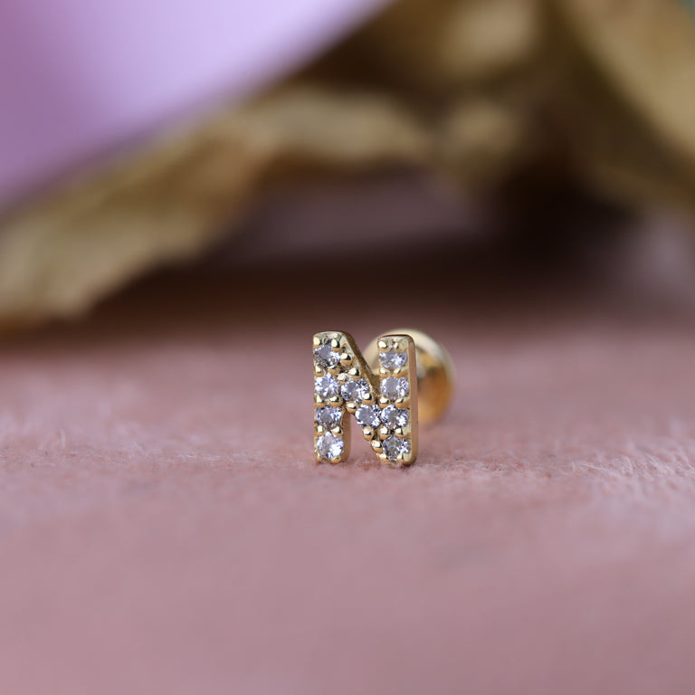 Piercing BUCHSTABEN