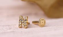 Piercing BUCHSTABEN