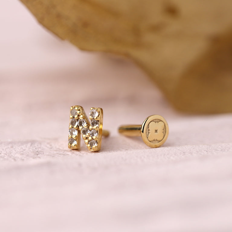 Piercing BUCHSTABEN